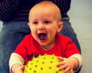 happy baby with ball